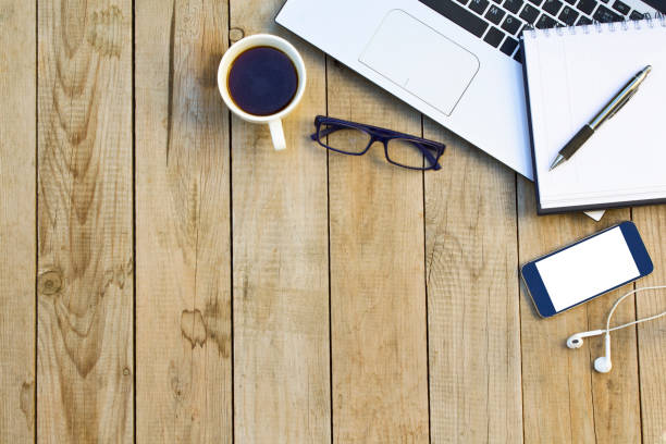 istock Business equipment on wooden table. Workplace and office concept. 1059802178