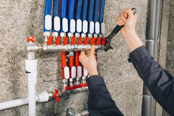 istock hands of plumber working in boiler room 1059809878