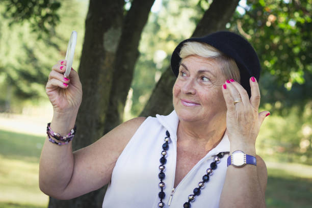istock Senior lady getting primped outdoors 1059819992