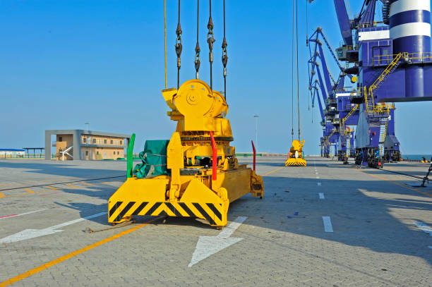 istock Port crane bridge and bulk carrier 1059833418