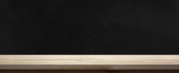 istock Wood table top on  blackboard background 1059835084