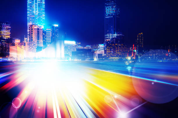 istock City night view with moving traffic light trails. double exposure 1059835706