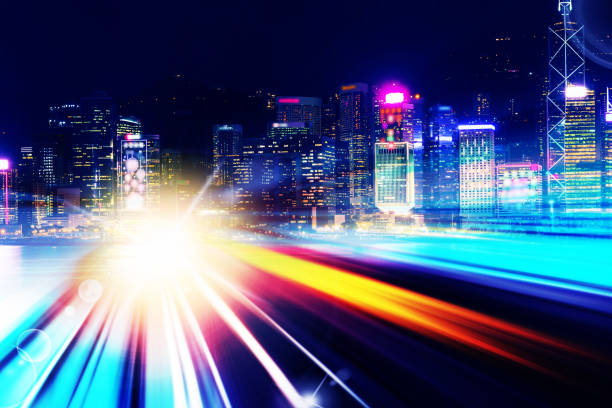 istock City night view with moving traffic light trails. double exposure 1059835804