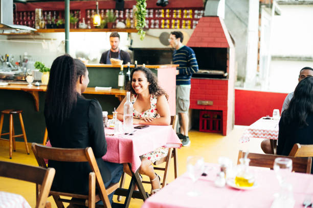 istock Two women enjoying lunch together in restaurant 1059836108