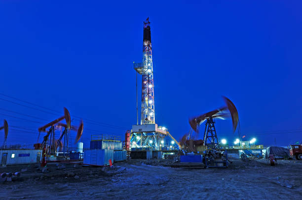 istock Oil drilling rig in the evening 1059837296