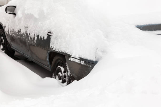 istock Car in the snowdrift on the parking lot 1059839028