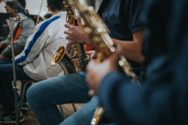 istock Midsection Of Saxophonist Playing Saxophone 1059839192