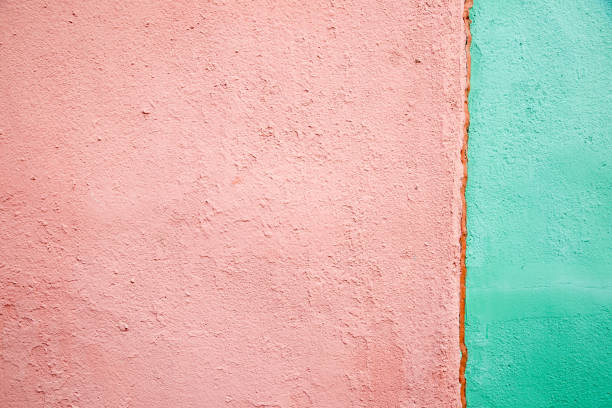 istock Pink and green color wall texture background 1059846184
