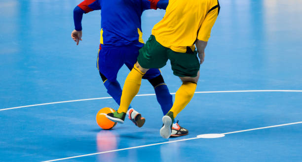 istock Low Section Of Men Playing Soccer 1059860116