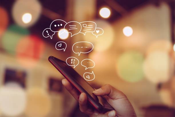 istock Women hand using smartphone typing, chatting conversation in chat box icons pop up. Social media maketing technology concept.Vintage soft color tone background. 1059860852