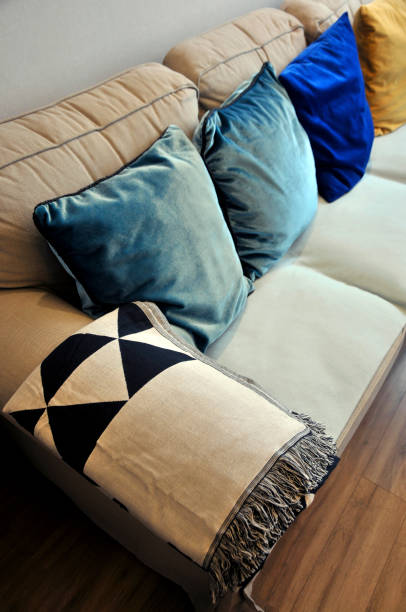 istock Beautiful colorful pillow setting on light gray comfy sofa 1059864818