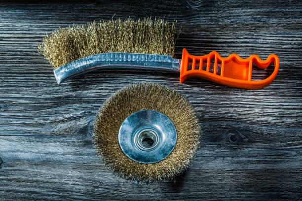 istock Rigid wire brushes on vintage wooden board 1059876638