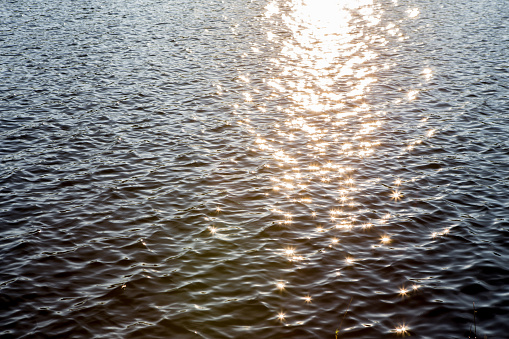 Sunlight reflected on the water is beautiful sparkling