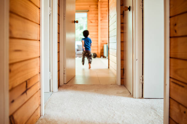 Kid running in corridor. stock photo