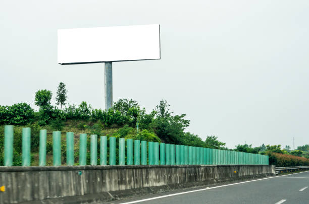 istock Blank billboard on blue sky background for new advertisement 1059888196