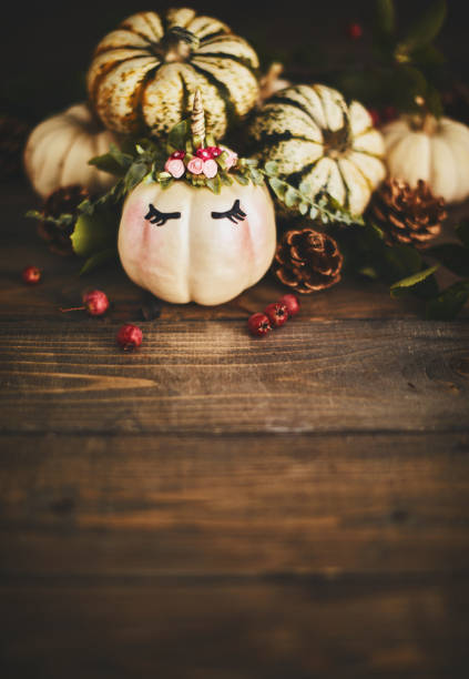 istock Handmade unicorn pumpkin with miniature real pumpkins 1059890346