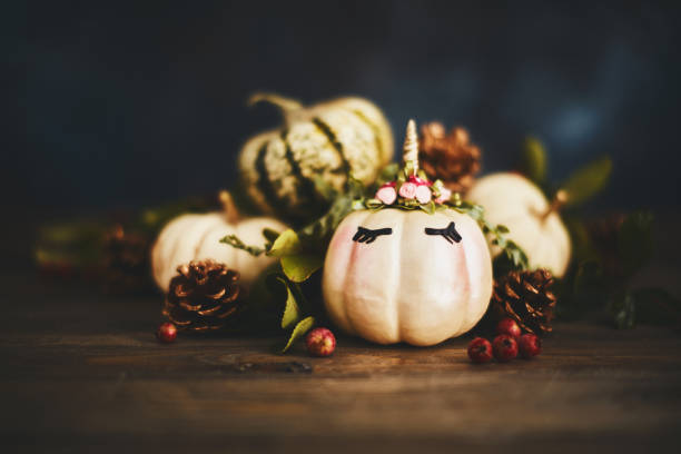 istock Handmade unicorn pumpkin with miniature real pumpkins 1059890352
