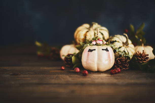 istock Handmade unicorn pumpkin with miniature real pumpkins 1059890356