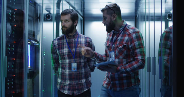 istock Coworking adult men diagnosing server hardware 1059910990