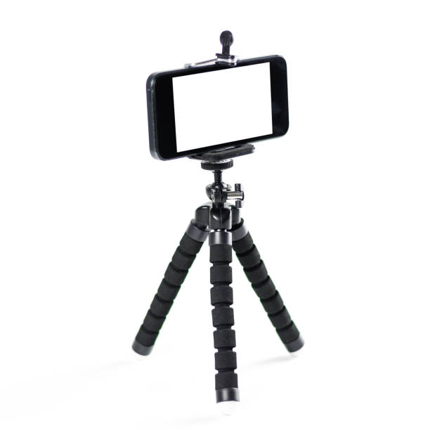 istock The phone on the tripod. Close up. Isolated on white background 1059930542