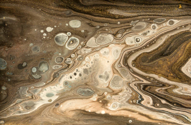 istock Gold marbling texture design. Beige and golden marble pattern. Fluid art. 1059931106