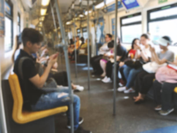 Abstract blurred people sitting on the sky train, public transportation. Interior abstract blurred background of public transit.