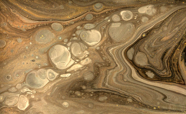 istock Gold marbling texture design. Beige and golden marble pattern. Fluid art. 1059933156