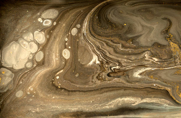 istock Gold marbling texture design. Beige and golden marble pattern. Fluid art. 1059933334