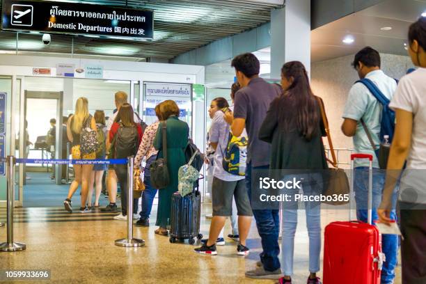 People Waiting In Line For Security Check At Airport Domestic Departures Stock Photo - Download Image Now