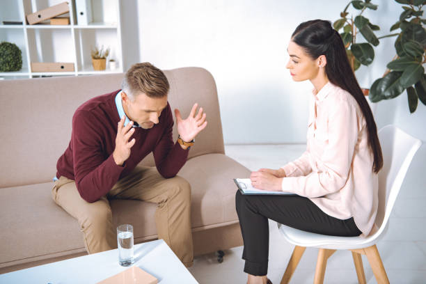 istock male patient having therapy appointment at psychologist office 1059944506