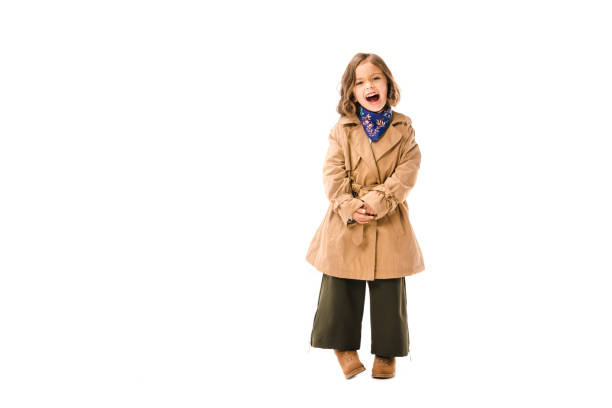 istock shouting little child in trench coat isolated on white 1059950916