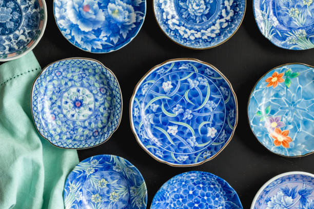 istock Blue and white decorative Japanese plates on black background - Top view photo 1059951700