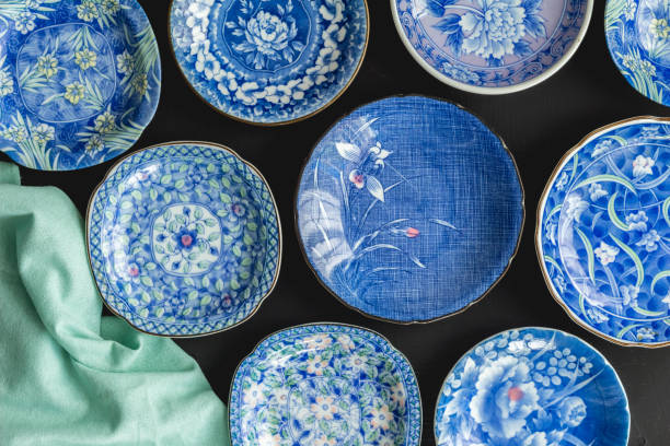 istock Blue and white decorative Japanese plates on black background - Top view photo 1059951714