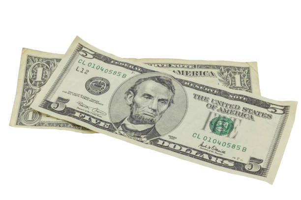 istock American dollar bills isolated on white background - One and Five Dollar Bills 1059951768
