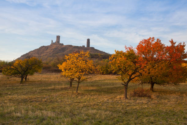 Famous Hazmburk Castle at sunset.Central Bohemian Uplands,Czech Republic. At the top of the mountain there is the ruin of a mediaeval castle, of which two towers and some wall fragments are still standing.