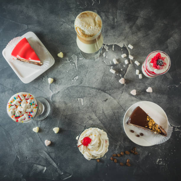 istock Food frame with milkshake drinks and desserts. Milkshakes and cake. Flat lay 1059955124