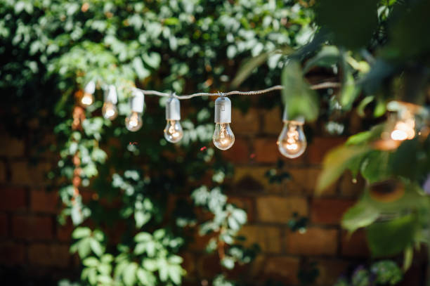 istock Light bulb decor in outdoor party. Party 1059955186