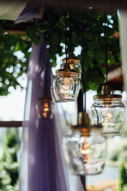 istock Light bulb decor in outdoor wedding ceremony 1059955472