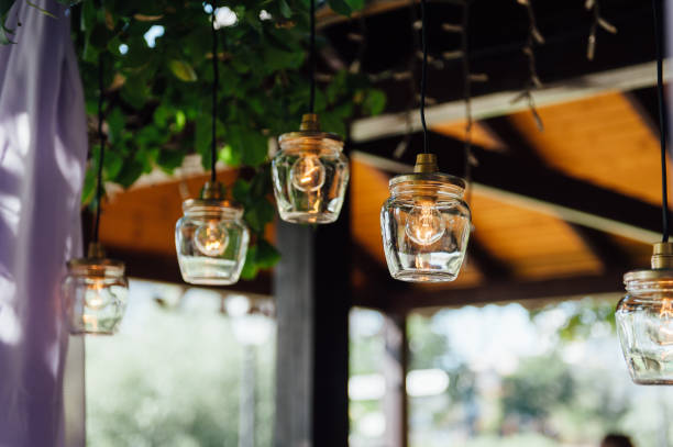 istock Light bulb decor in outdoor wedding ceremony 1059955488