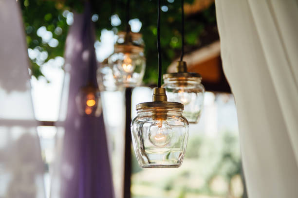 istock Light bulb decor in outdoor wedding ceremony 1059955506