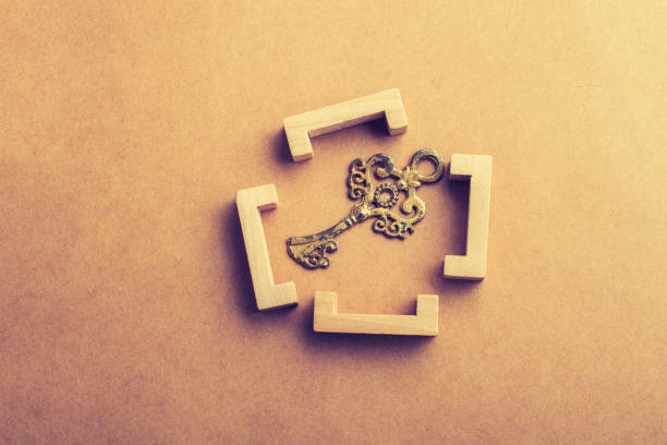 istock Retro style key in wooden brackets 1059957664