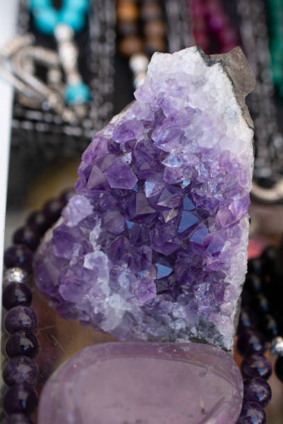 istock Raw violet amethyst rock with crystal ametist 1059957742