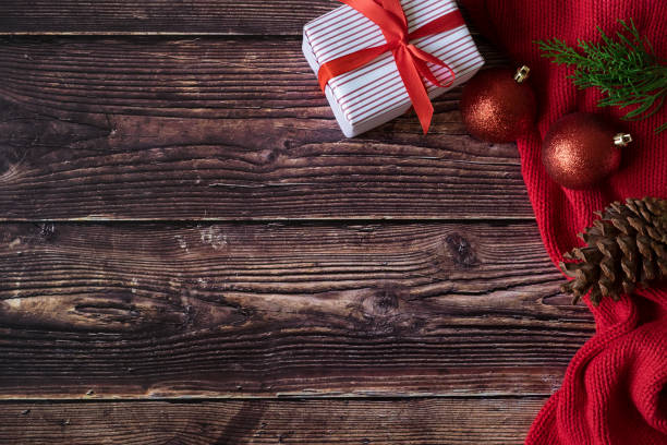 istock Christmas and New Year gift boxes on woodden background. 1059957824
