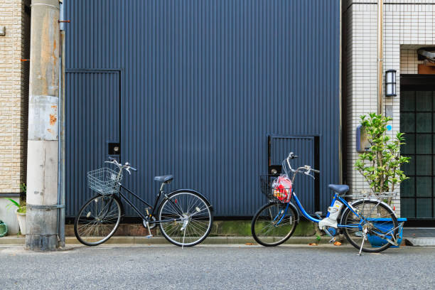 istock bicycles park on the road with metal wall background 1059957998
