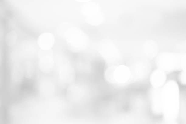 istock abstract blurred white color background with bokeh light for design concept 1059959980