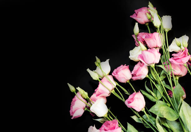 istock Bouquet pink and white flowers on a black background 1059961292