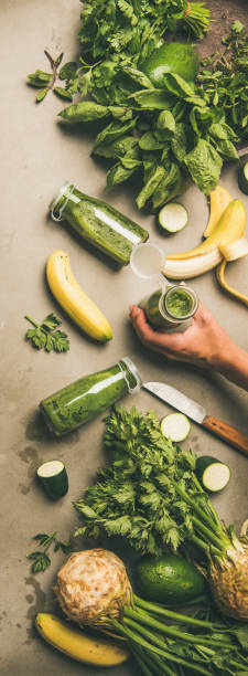 istock Ingredients for making smoothie and female hands with, concrete background 1059965884