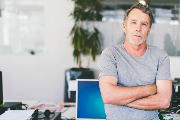 istock Confident Businessman Standing With Arms Crossed 1059974802