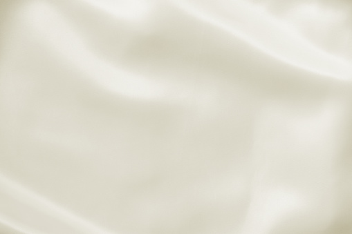 Resumen arrugado fondo blanco luz boda amarillo crema con seda, satén o tela dobla y cortinas textura de la tela. Paño de lujo, raso ondulado grunge textura material del terciopelo o lujosas vacaciones de Navidad. photo