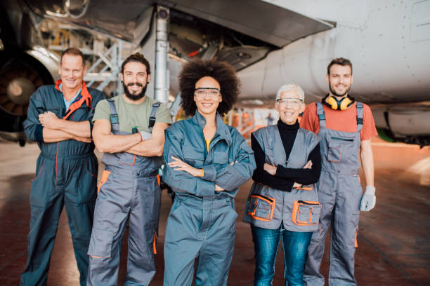 istock Mechanics working at airplane hangar 1059982120